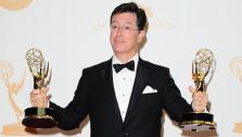 Stephen Colbert, host of The Colbert Report, appears with his two Emmys at the 2013 Emmy Awards on Sept. 22, 2013. Colbert drew controversy on March 27, 2018 over a Twitter comment many deemed racist, which was also made on the show. - Provided courtesy of Kyle Rover / Startraksphoto.com