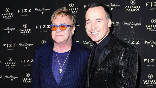 Elton John and David Furnish appear at Fizz Las Vegas to celebrate the singers 67th birthday on March 28, 2014. - Provided courtesy of Dave Proctor / startraksphoto.com