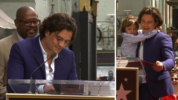 Orlando Bloom, with son Flynn, thanks Miranda Kerr during his speech at the unveiling of his star on the Hollywood Walk of Fame on April 2, 2014.