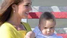 Kate Middleton, aka Catherine, Duchess of Cambridge, carrying son Prince George, and husband Prince William exit an airplane after landing in Sydney, Australia, as part of their Royal Tour. - Provided courtesy of Paul McConnell / Startraksphoto.com