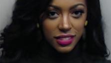 Real Housewives of Atlantas Porsha Williams is seen in a police mug shot taken after she was arrested for misdemeanor battery on April 16, 2014. A warrant was issued after she and co-star Kenya Moore got into a confrontation at a reunion show taping. - Provided courtesy of Wilford Harewood / Bravo / Fulton County Sheriffs Office