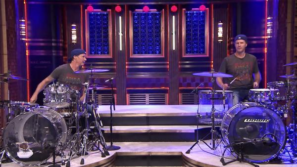 Chad Smith of the Red Hot Chili Peppers and Will Ferrell take part in a drum-off on The Tonight Show starring Jimmy Fallon in an episode that aired on May 22, 2014. - Provided courtesy of NBC