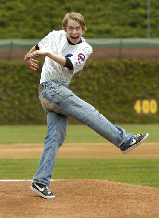 Macaulay Culkin reacts after throwing the...