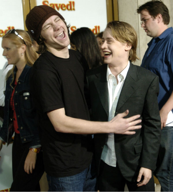 'Saved!' cast members Patrick Fugit, left, and Macaulay Culkin share a laugh at a screening of the film in the Westwood section of Los Angeles on Thursday, May 13, 2004.