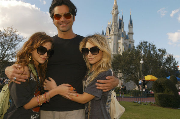 Mary-Kate, left, and Ashley Olsen are seen with...