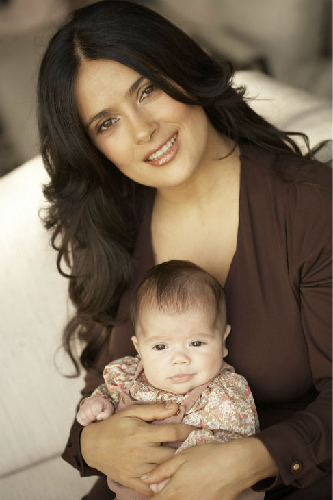 Salma Hayek poses with her new daughter...