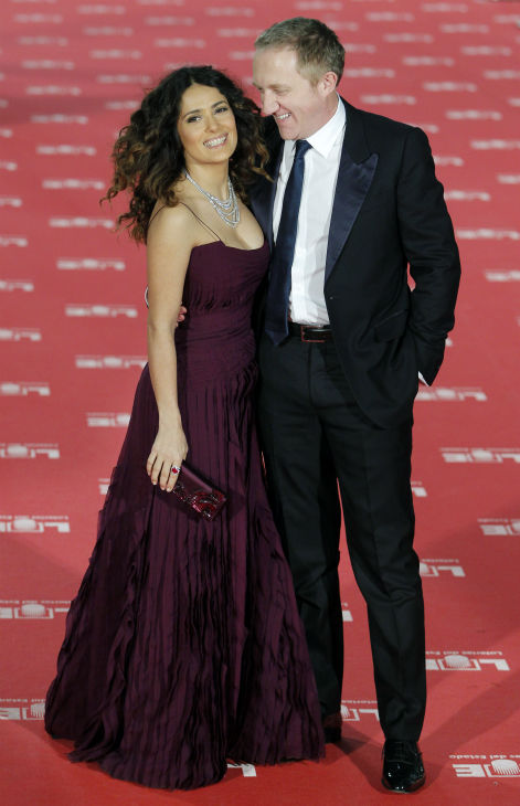 Salma Hayek poses with her husband...