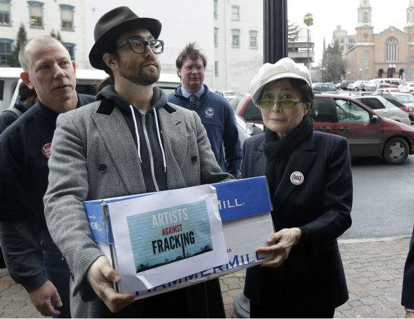 Sean Lennon and Yoko Ono help deliver boxes of...