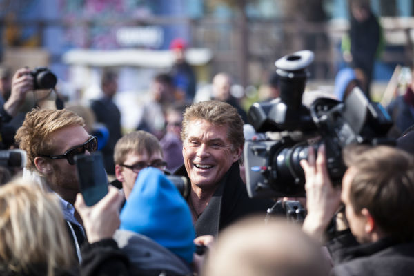 David Hasselhoff, center, arrives for a protest against the removal of a section of the East Side Gallery, a historic part of former Berlin Wall, in Berlin on March 17, 2013.