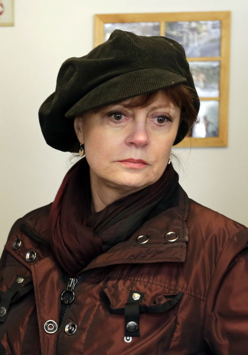 Actress Susan Sarandon visits a family during a...