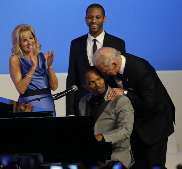 Vice President Joe Biden talks to Jamie Foxx as...