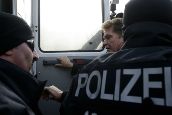 David Hasselhoff, center, is accompanied by...