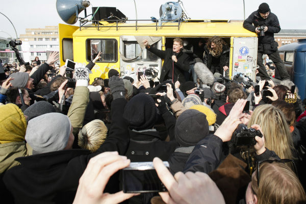 David Hasselhoff, center, speaks to the crowed...