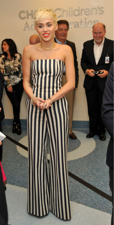 Miley Cyrus waits to be introduced at the West...