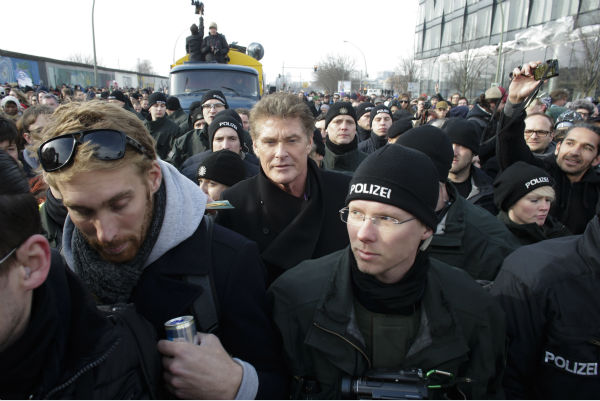 David Hasselhoff, center, is surround by police...