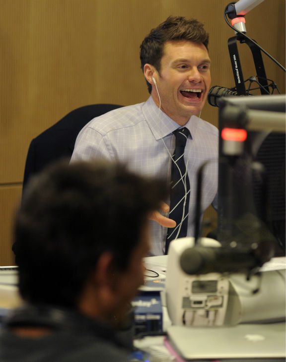 Ryan Seacrest interviews actor Taylor Lautner,...
