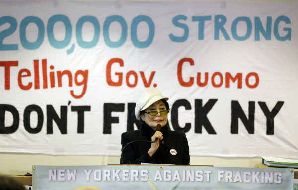 Yoko Ono speaks during a news conference...