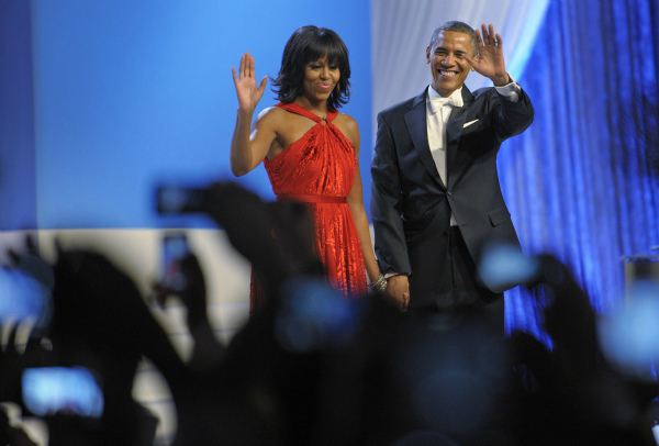 First Lady Michelle Obama dances with President...