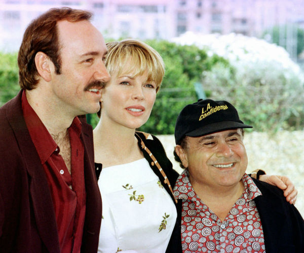 Kim Basinger poses between Kevin Spacey, left,...