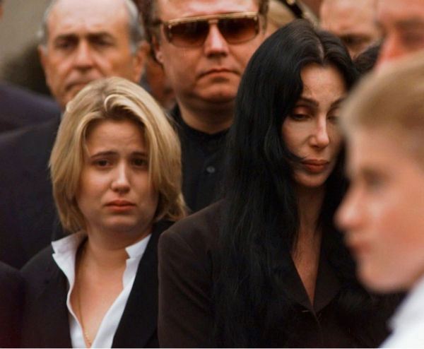 Chastity Bono left, and Cher exit St. Theresa...