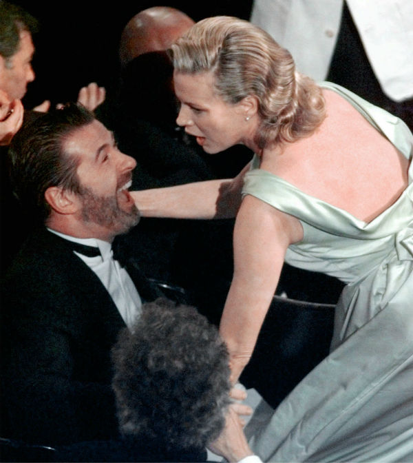 Kim Basinger reaches for her husband, Alec...