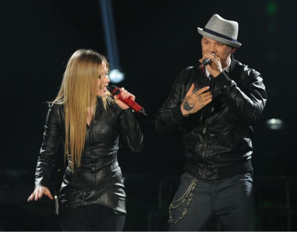 Chris Rene (R) and Avril Lavigne perform her...