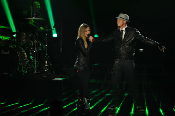 Chris Rene (R) and Avril Lavigne perform her 2002 song 'Complicated' on 'The X Factor' pre-finale on Dec. 21, 2011 on FOX.