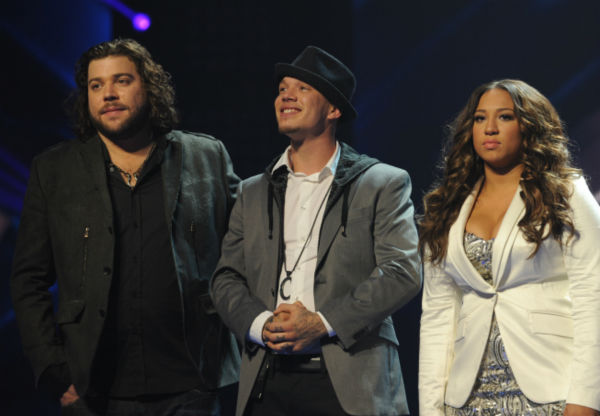 L-R: Top three finalists Josh Krajcik, Melanie Amaro and Chris Rene appears on stage on 'The X Factor' pre-finale on Dec. 21, 2011 on FOX.