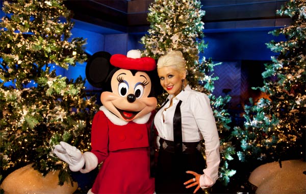 Christina Aguilera poses with Minnie Mouse following the taping of the 2011 Disney Parks Christmas Day Parade at Disney's Grand Californian Hotel and Spa in Anaheim, California, on Nov. 6, 2011.