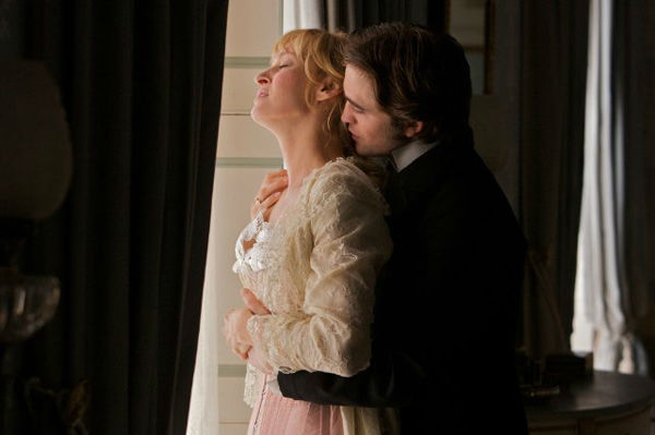 Robert Pattinson and Uma Thurman appear in a still from the 2012 movie 'Bel Ami.'