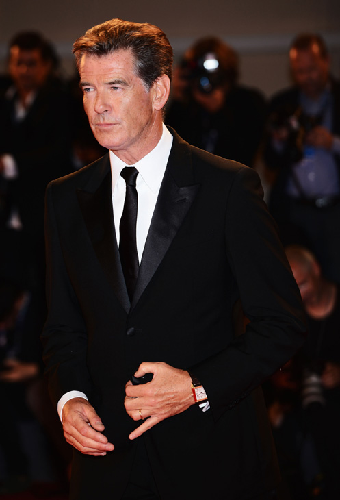 Pierce Brosnan, wearing a suit and a Squadra...