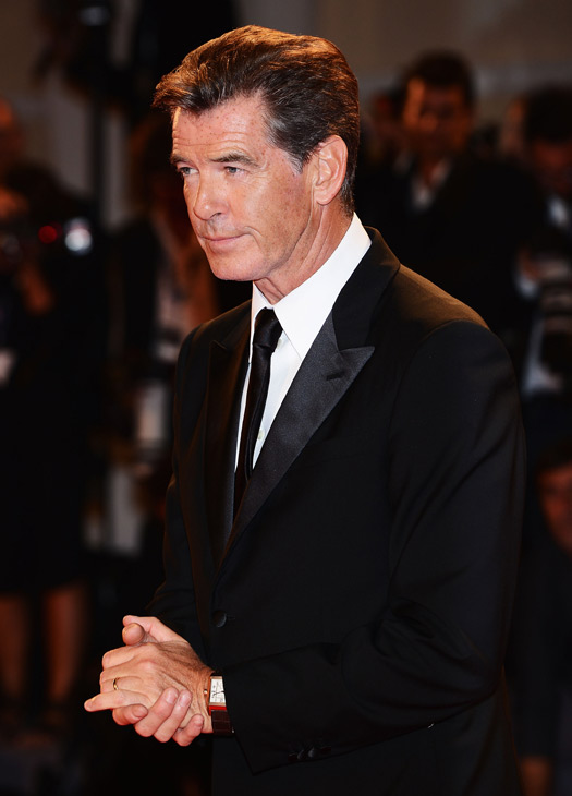 Pierce Brosnan, wearing a suit and a Squadra...