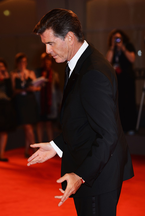 Pierce Brosnan, wearing a suit and a Squadra...