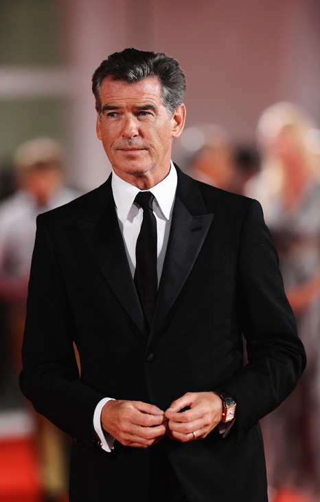 Pierce Brosnan, wearing a suit and a Squadra...