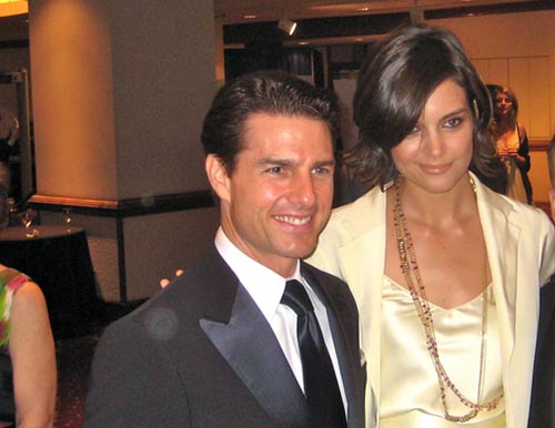 Katie Holmes and Tom Cruise appear in a photo...