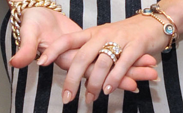 Miley Cyrus wears her engagement ring to the...