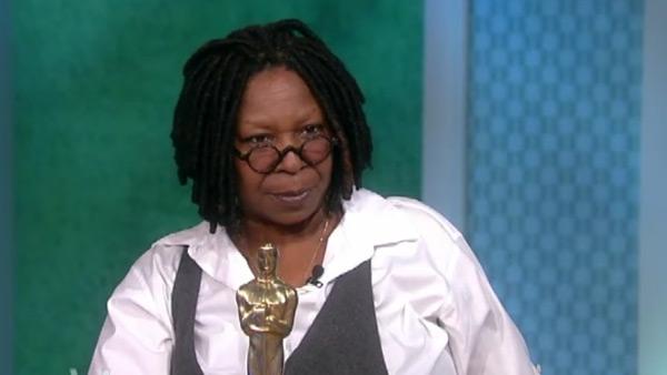 Whoopi Goldberg holds her Oscar in a Feb. 14,...