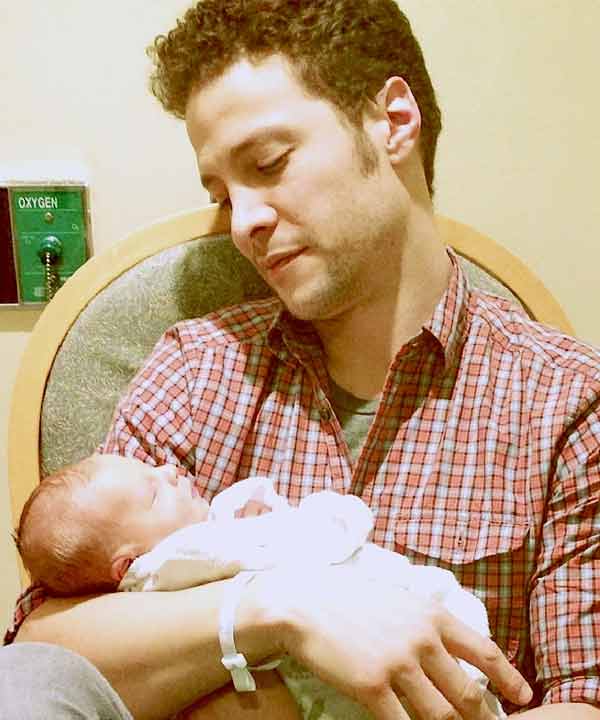 Justin Guarini appears in a photo holding his son, Asher, who was born on Feb 25. 2013. - Provided courtesy of JEFF BALLARD PR Justin Guarini appears in a photo holding his son, Asher, who was born on Feb 25. 2013. - Provided courtesy of JEFF BALLARD PR