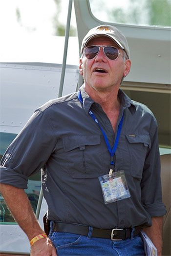 Harrison Ford appears in a photo watching the...