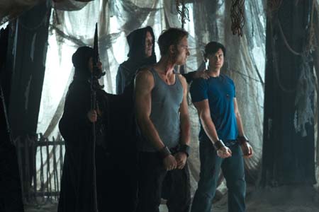 Justin Hartley appears as Oliver Queen and Tom...