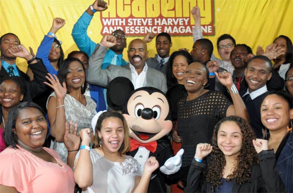Steve Harvey and high school students pose with...