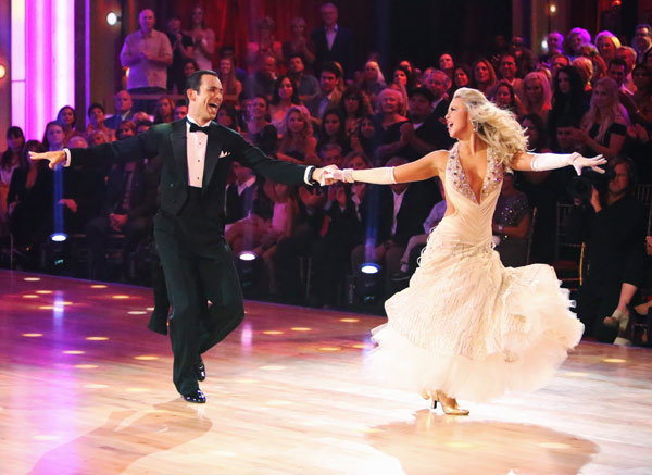 Helio Castroneves and Chelsie Hightower appear...