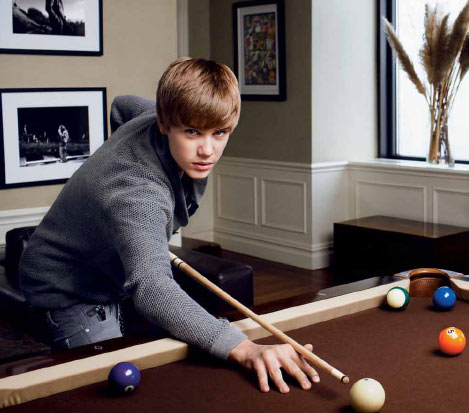 Justin Bieber plays pool in a photograph...