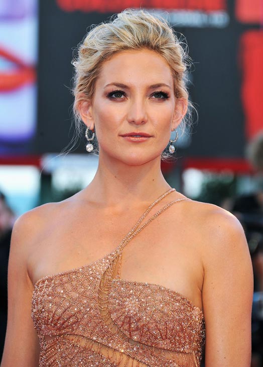 Kate Hudson, wearing an Atelier Versace gown and...