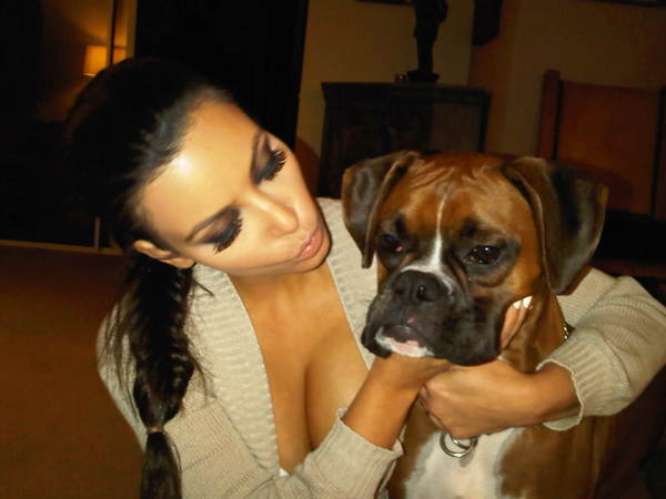 Kim Kardashian loves to snuggle with her pup,...