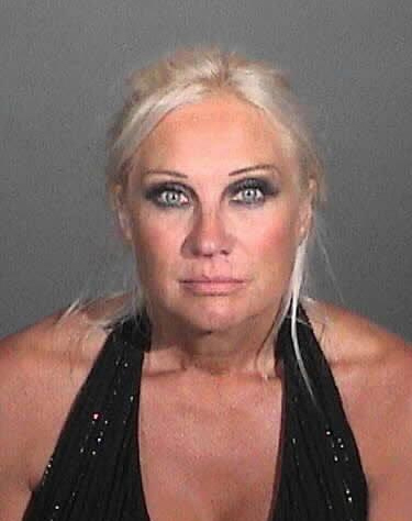 Linda Hogan appears in a booking photo after...