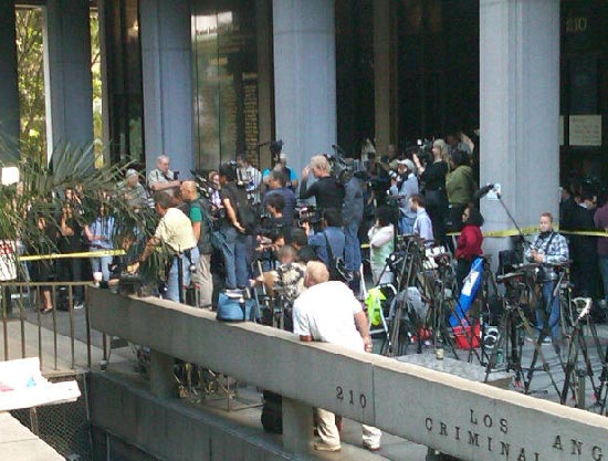 Sept. 27, 2011: Photojournalists stand outside...