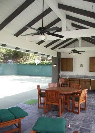 A dining area overlooking a basketball court at...