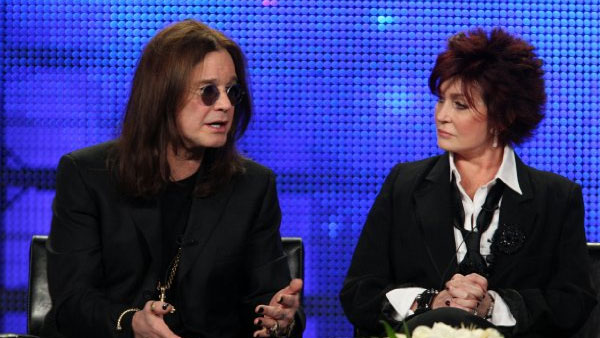 Ozzy Osbourne appears next to his wife Sharon in...