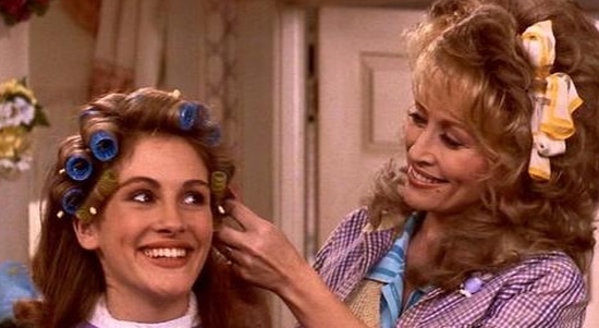 Dolly Parton and Julia Roberts appear in a scene...